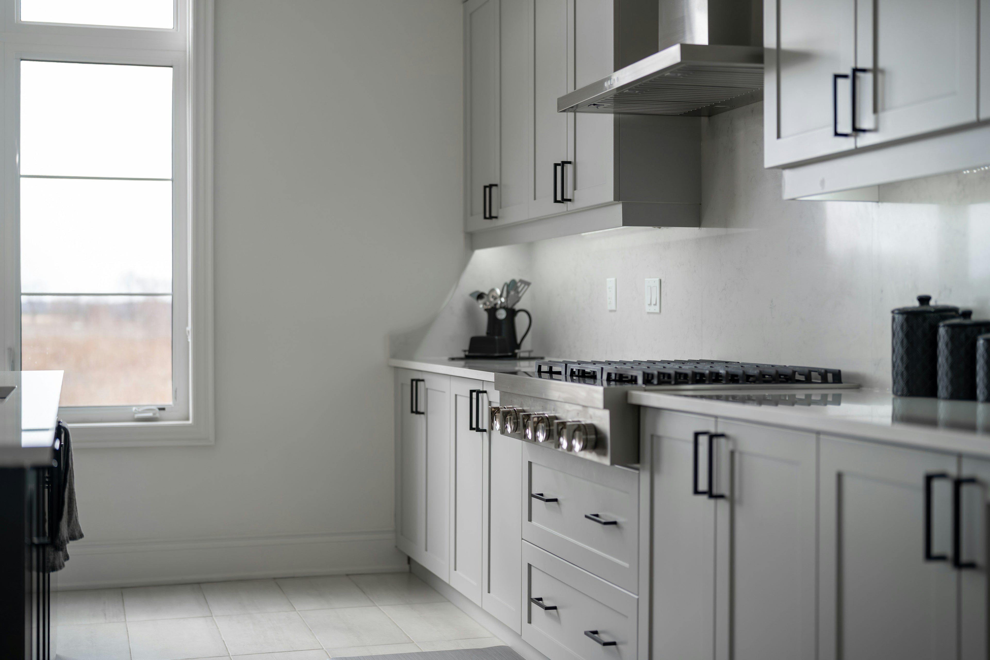 Kitchen storage containers and organizers neatly arranged in a clean and organized kitchen space