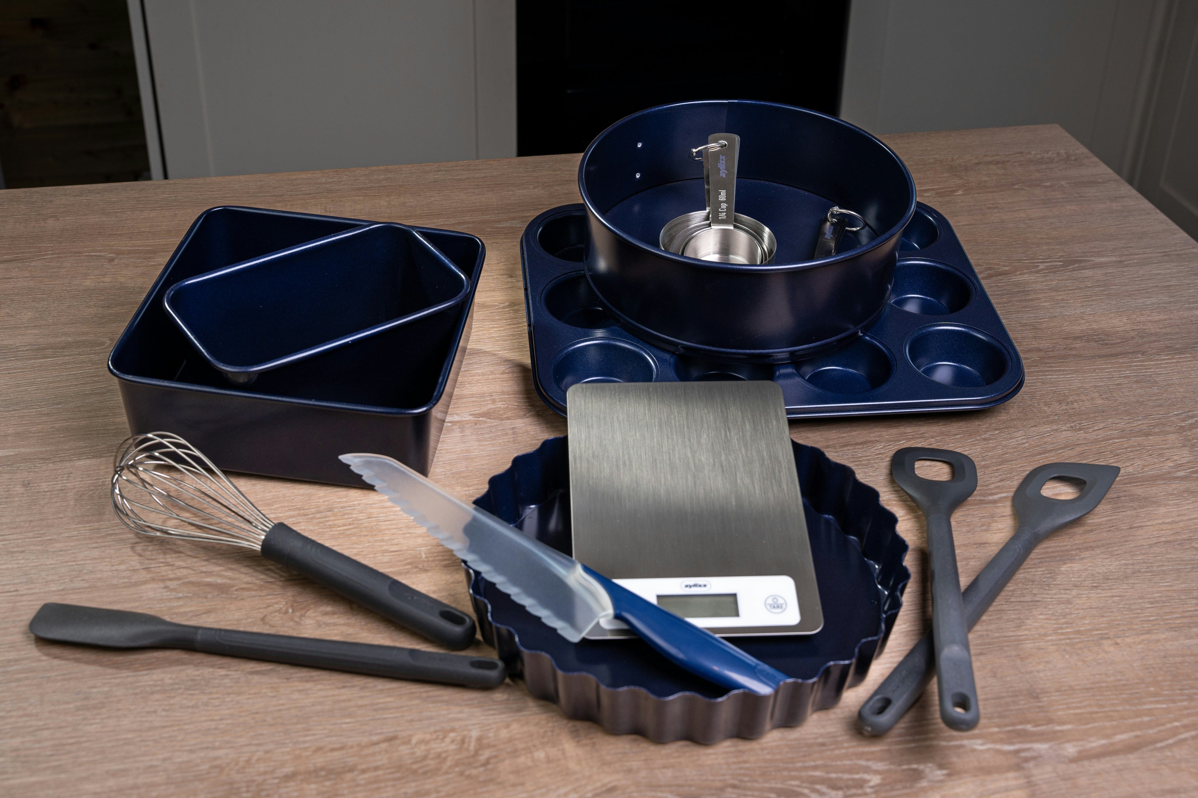 Smart kitchen tools including digital thermometer and electric cooking gadgets on a modern kitchen countertop